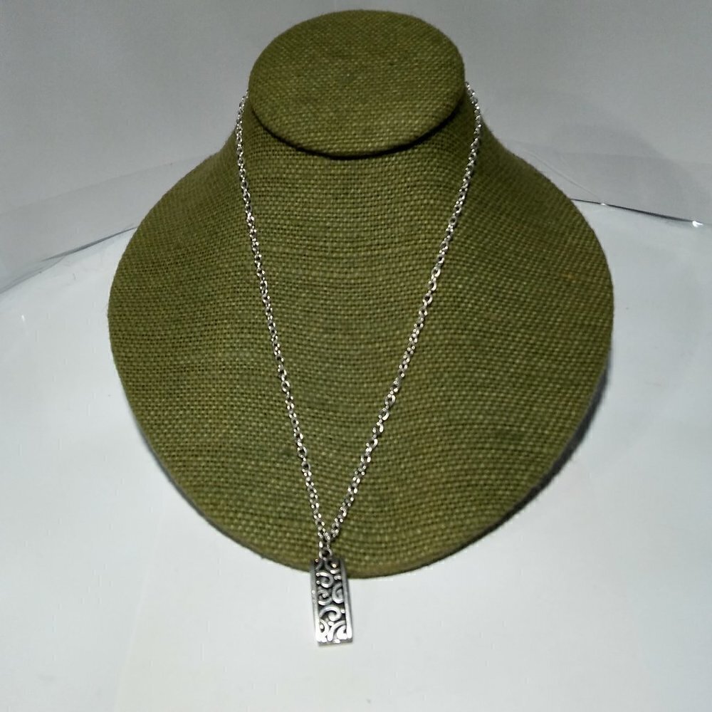 Women`s silver tone filigree bar necklace.